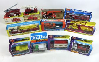 A collection of eleven die-cast and metal trucks and lorries, including Corgi, Dinky, Super Kings,