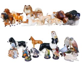 Over 25 ceramic figurines of animals, including dogs and birds. (qty)