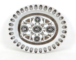 A Marigold pattern meat plate with a well, 48cm by 40cm by 6cm. Hairline crack to one side, some