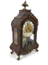 A 19th century French Bouille tortoiseshell and ormolu mantle clock with scroll acanthus and bird