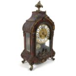 A 19th century French Bouille tortoiseshell and ormolu mantle clock with scroll acanthus and bird