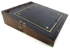 A Victorian walnut brass bound writing slope, with fitted interior and secret drawers 45cm by 25cm