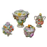 Four pieces of Coalbrookedale for Coalport floral encrusted lidded vases/pot, largest 17cm by 14cm