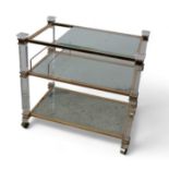 A clear glass and brass /gilt drinks trolley, three tier, rectangular, Italian.