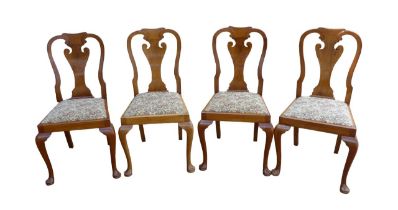 A set of four mid 20th century walnut veneered dining chairs, in Queen Anne style, with drop in