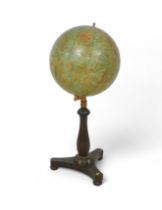 A Philips 19 inch library globe on a mahogany tripartite platform stand, 48 by 108cm tall.