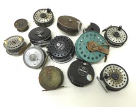Eleven assorted fly fishing reels including Daiwa, A Carter & Co, and Milward.