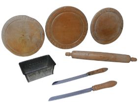 A collection of Hovis and Allinsons bread boards and knives, together with an Allinsons bread