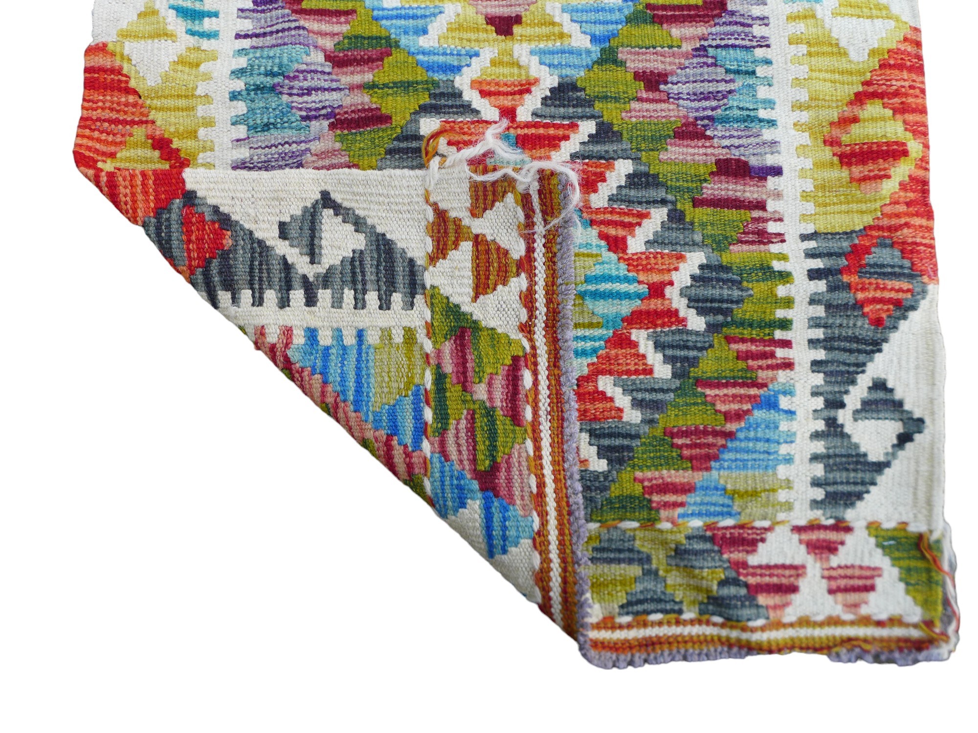 Multicoloured geometric hand knotted woollen carpet runner rug, 152 by 67cm. - Image 2 of 3