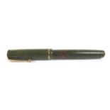 A Parker Moderne fountain pen, green and brown marble effect with gilt metal mounts, nib marked '