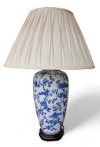 An Oriental style blue and white table lamp with shade, 56cm by 83cm tall.