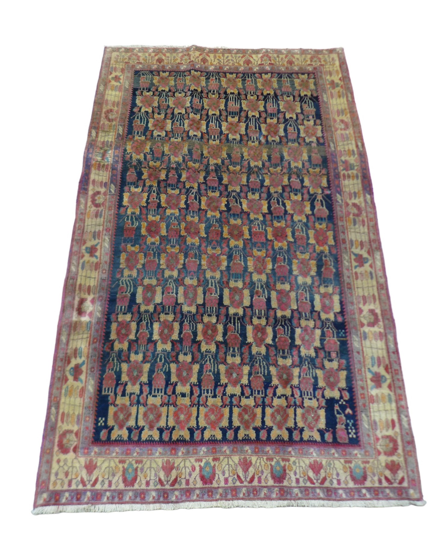 A Hamadan rug, on dark navy ground with repeat pattern to central panel, with large Caucasian border