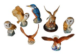 Two Beswick eagles and other bird figurines, including an oversized Kingfisher. (7)