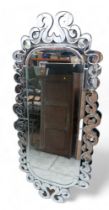 An oval modern Venetian style mirror