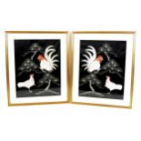 A pair of Asian embroidered panels, depicting exotic birds on a black ground, 49 by 39cm, each