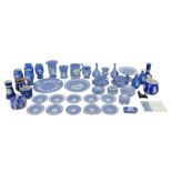 A large group of Wedgwood blue jasperware, including vases, plates, two cups and saucers, comport,