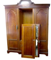 A large mahogany wardrobe, in three sections