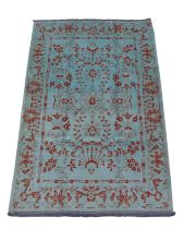 A Shiraz rug, on teal ground with burnt orange decoration, 220 by 115cm.