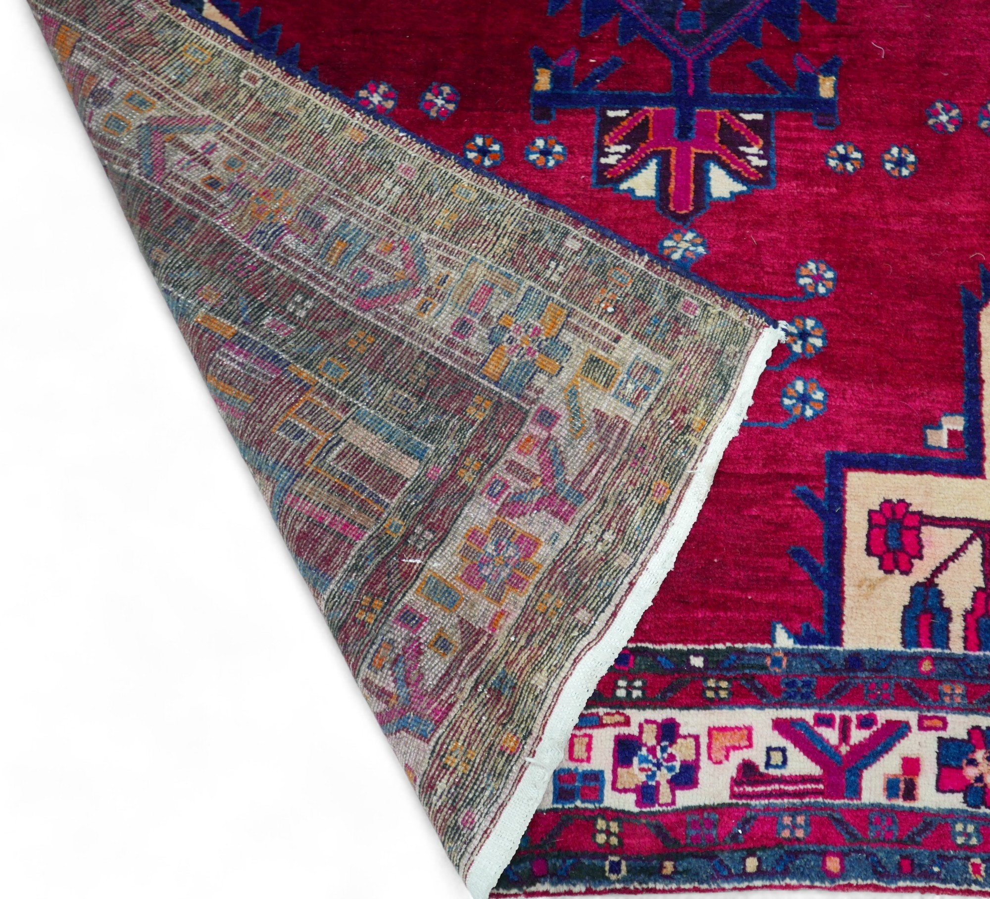 A Persian rug, with red ground and geometric floral decoration, central blue medallion with - Image 3 of 3