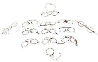 A collection of 19th century and later spectacles and pince nez, together with one monocle, some