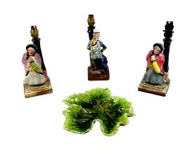 A group of four pieces of Bretby pottery, comprising two Sairey Gamp Dickens character lamp bases,