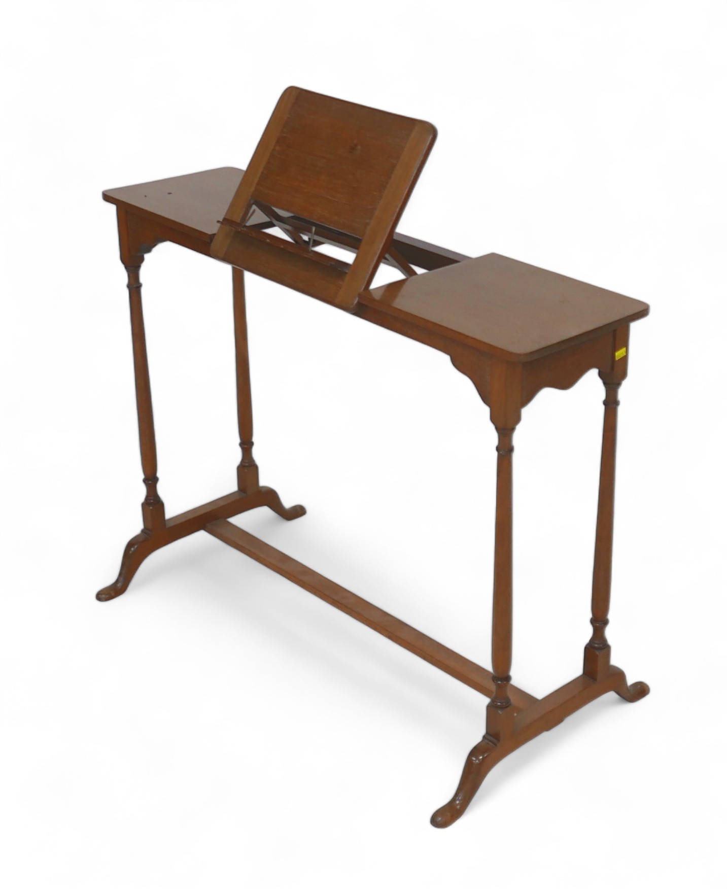 An early 1900s mahogany library reading table with a folding bookrest 93.5 by 46.5 by 68.5cm tall.