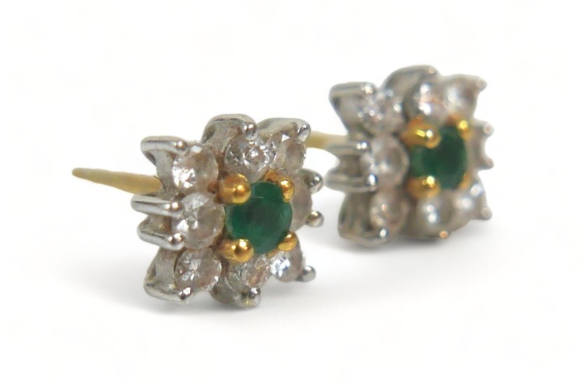 A pair of diamond and emerald flowerhead earrings, each comprising eight brilliant cut diamonds - Image 2 of 4