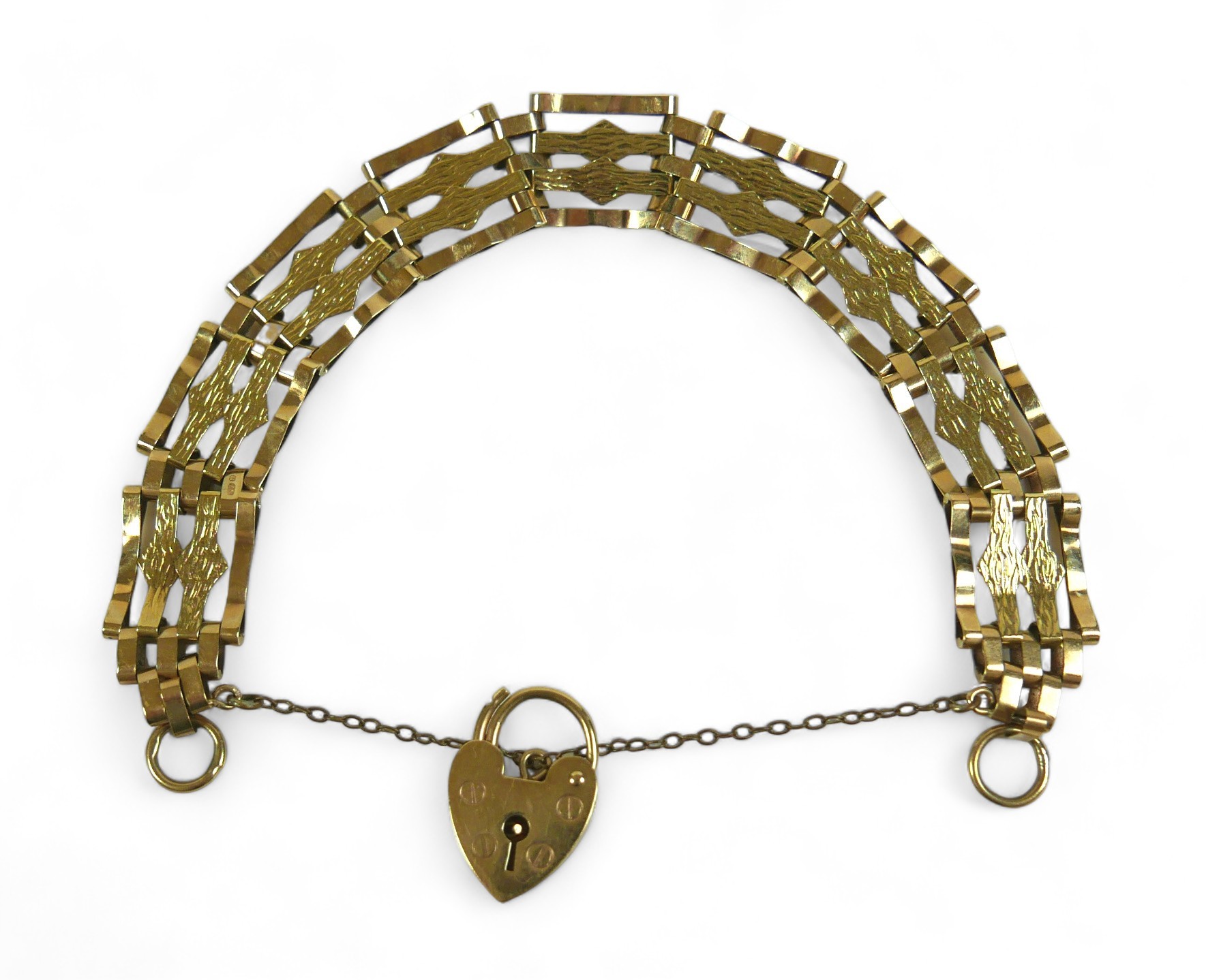 A 9ct gold bar gate bracelet with heart shaped lock and central textured bands, 10.6g. - Image 2 of 5