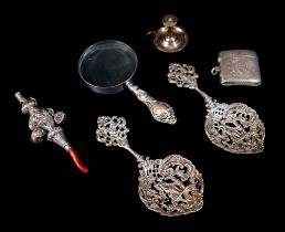 A small group of silver items, comprising a Victorian silver baby's rattle with coral teether,