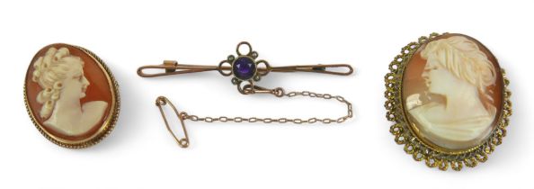 A Victorian 9ct rose gold, amethyst and black seed pearl bar brooch, 5.8cm long, 3.6g, plus two