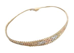 A 9ct tri-gold flat weave bracelet, 5.2g, 18.5cm long.