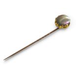 A gilt metal mother of pearl pin, head 14 by 11mm. Gross weight 4.6 grams.