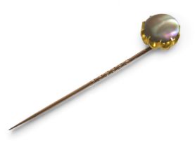 A gilt metal mother of pearl pin, head 14 by 11mm. Gross weight 4.6 grams.