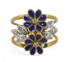 A diamond and enamel flower head ring, with eight small diamonds, the band stamped '750', size M,