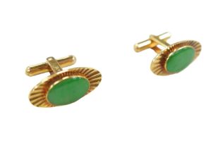 A pair of 14ct gold and jade style stone inlaid cufflinks, with gilt metal hinged bars, 11.7g gross,