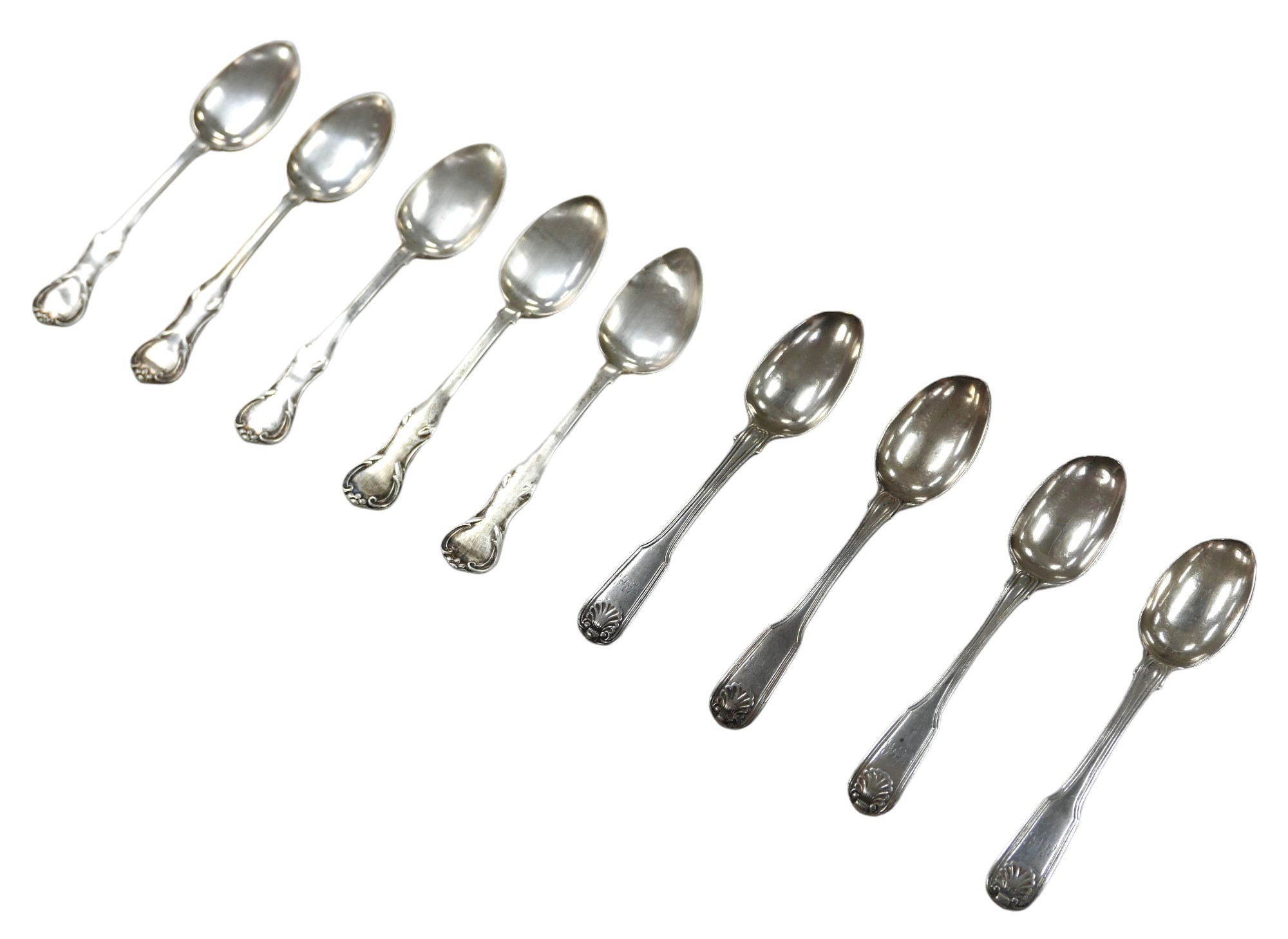 A collection of George III and later silver teaspoons, comprising four George III fiddleback pattern