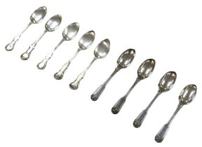 A collection of George III and later silver teaspoons, comprising four George III fiddleback pattern