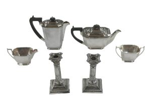 A pair of George V silver candlesticks, rubbed hallmarks, possibly Williams (Birmingham) Ltd.