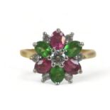 An 18ct gold, diamond and tourmaline thirteen-stone flowerhead cluster ring, the central brilliant