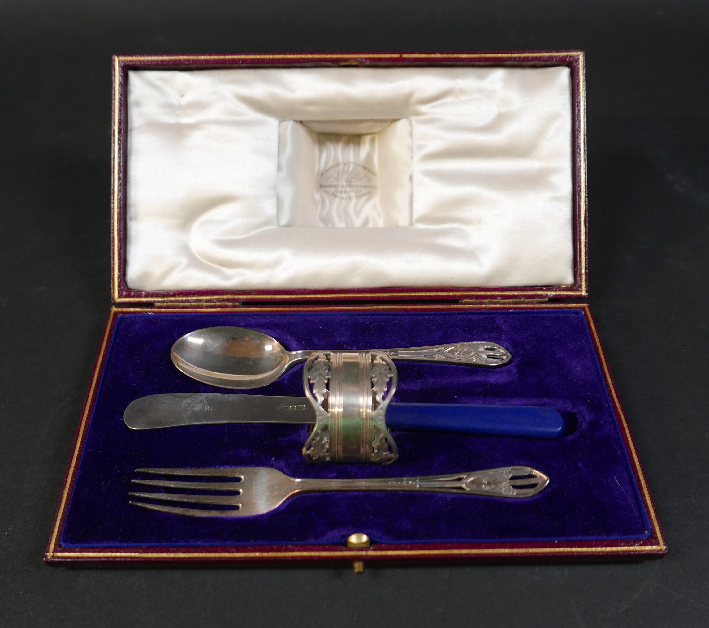 A boxed silver christening set with replacement plated knife, Goldsmiths and Silversmiths Co, London