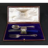 A boxed silver christening set with replacement plated knife, Goldsmiths and Silversmiths Co, London