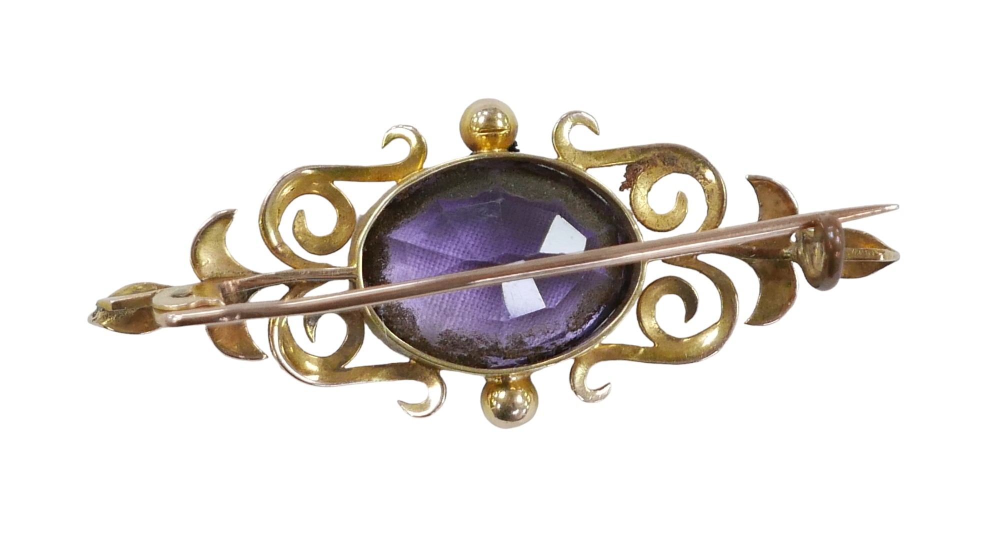 A yellow metal and amethyst bar brooch, the oval cut stone, 16 by 13mm, 7.8g, with fitted case. - Image 2 of 2