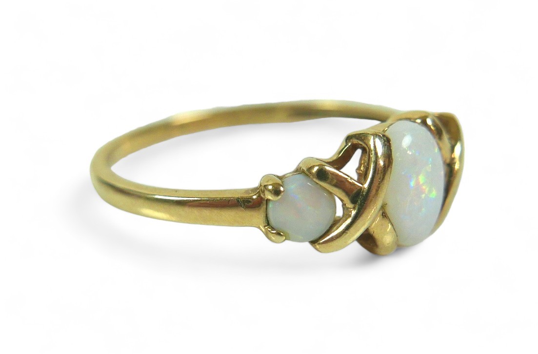 A group of three dress rings, comprising a three stone opal ring, largest stone 12.02 by 10.16mm, - Image 6 of 13