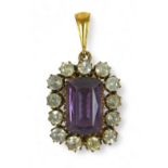 An amethyst and gold-set pendant with white stone border emerald-cut amethyst, testing as 9ct gold