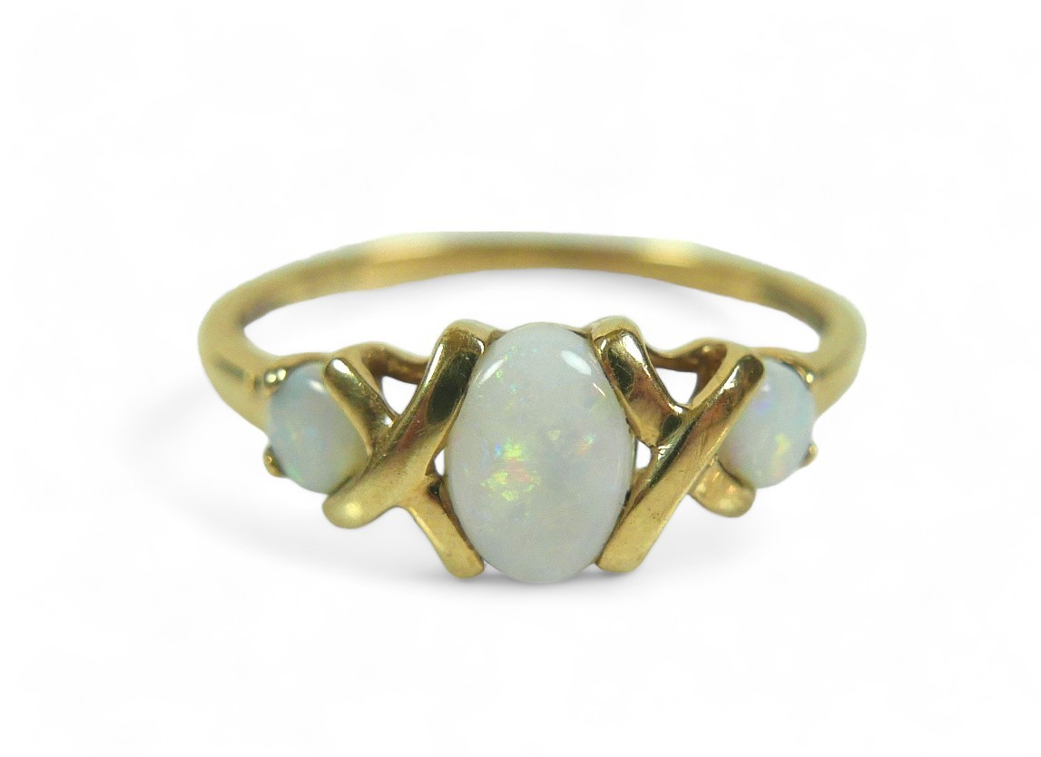 A group of three dress rings, comprising a three stone opal ring, largest stone 12.02 by 10.16mm, - Image 5 of 13