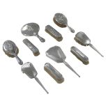 Two sets of silver backed dressing table brushes and hand mirrors, including a set of five, with