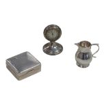 Three pieces of George V silver, comprising a silver cased travel clock with silvered Arabic dial,