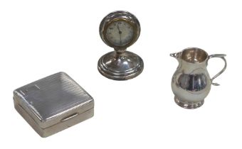 Three pieces of George V silver, comprising a silver cased travel clock with silvered Arabic dial,