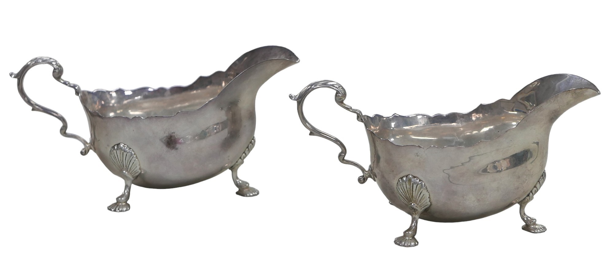 Two ERII silver sauce boats, Garrard & Co. Ltd. London, 1965, 12toz, 18 by 9 by 9cm high. (2)