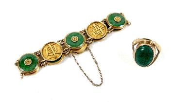 A Chinese 18ct yellow gold and jade set bracelet, formed of circular panels decorated with Chinese